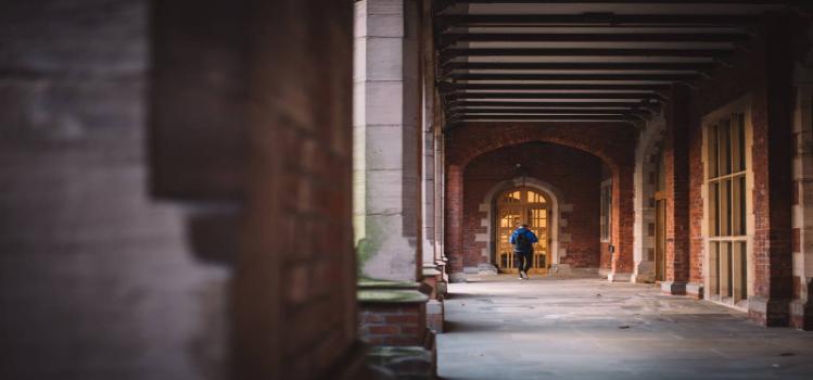 person walking in quad arches